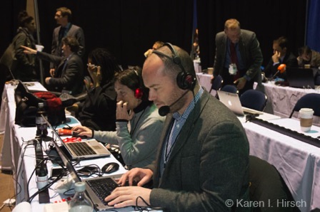 reporters at work on their laptops